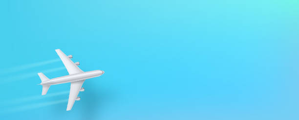 istock Silver airplane, top view. Flying plane on a blue background. The concept of advertising banner for travel agencies, travel. Plane for travel. Jet commercial airplane in blue sky. 1139212548