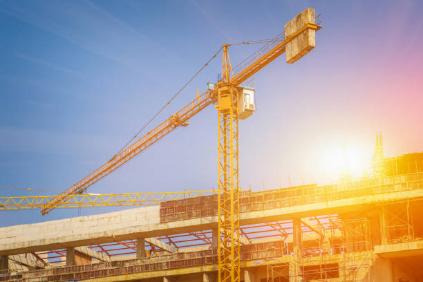 istock construction crane, building and blue sky as industrial concept 1139214450