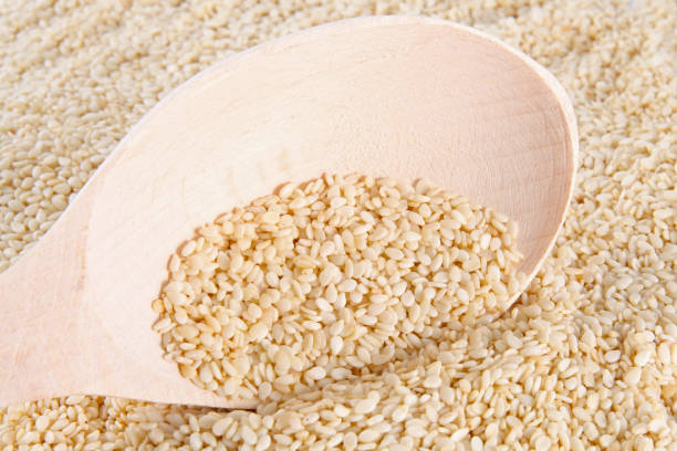 istock sesame seeds  with wooden spoon 1139216442