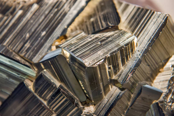Macro mineral stone Pyrite gold on white background close up