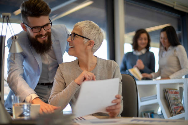 istock Group of multi generation business colleagues  in open hub office 1139220923