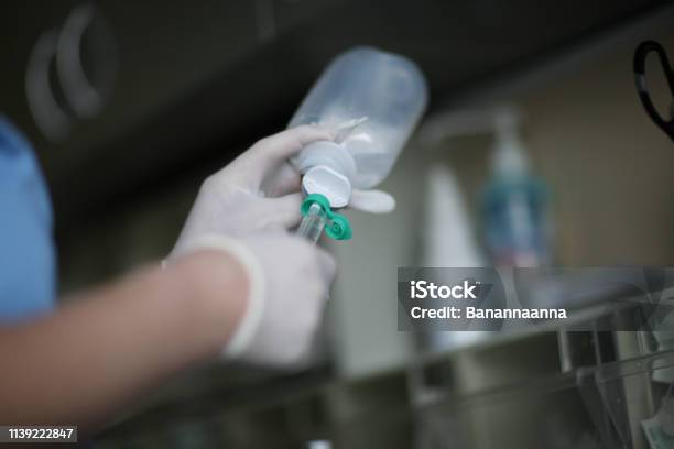 The Nurse Fills The Syringe With A Medicine Stock Photo - Download Image Now - Medicine, CPR, Hand
