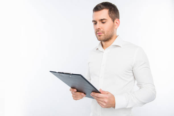 istock Portrait of young man holding a folder 1139226916