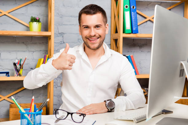 istock Attractive young manager showing thumb up in the office 1139227080
