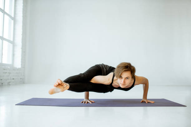 istock Woman practising yoga indoors 1139227255