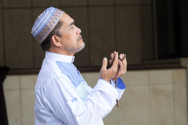 istock Man Holding Prayer Beads While Praying At Mosque 1139230119