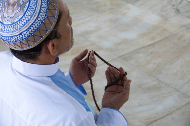 istock Man Holding Prayer Beads While Praying At Mosque 1139230151