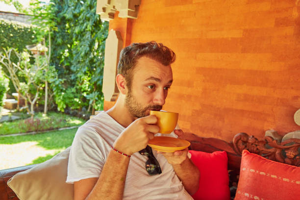 istock Man drinking coffee on a home porch. 1139231508