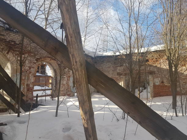 istock abandoned and destroyed red brick building in winter. 1139233615