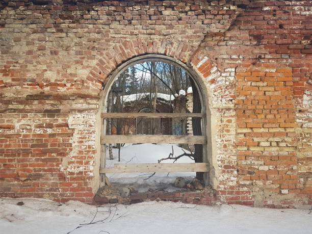 istock abandoned and destroyed red brick building in winter. 1139233622