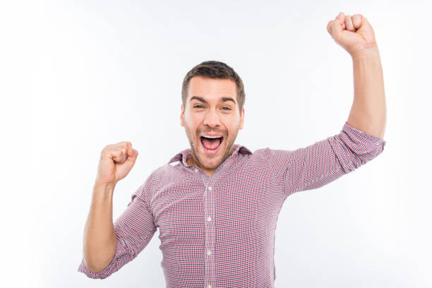 istock Attractive young man screaming and showing fists 1139237664