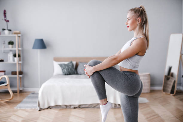 istock Sporty young woman training at home. 1139239308