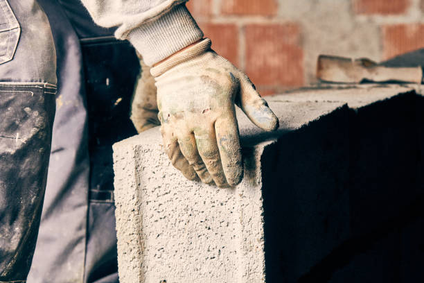istock Real construction worker bricklaying the wall indoors. 1139239889
