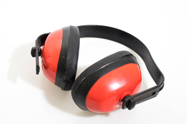 istock Red safety headphones in a white background composition 1139240428
