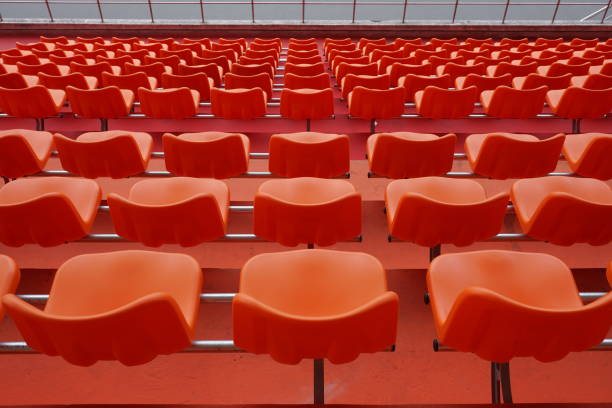 istock A lot of orange chairs in the stadium. 1139242555