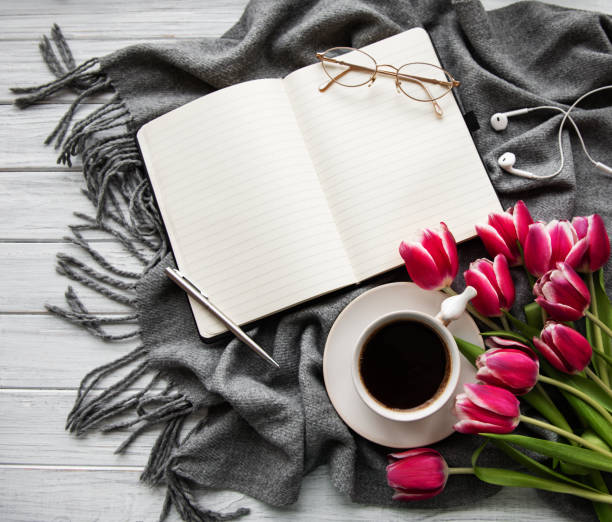 istock Notebook, cup of coffee  and pink tulips 1139243694