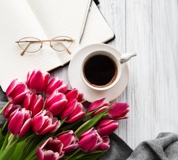 istock Notebook, cup of coffee  and pink tulips 1139243701
