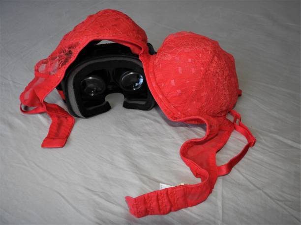 istock Virtual reality glasses for mobile devices with red underwear on top, VR technology is used for VR porn and adult entertainment. 1139243763