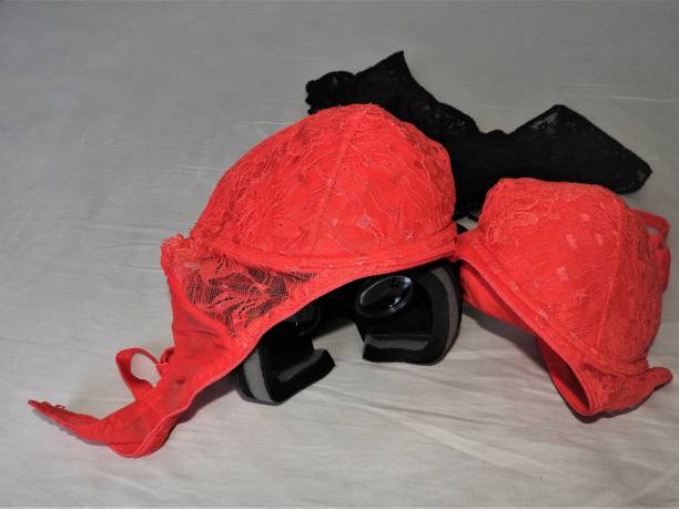 Virtual reality glasses for mobile devices with red underwear on top, VR technology is used for VR porn and adult entertainment.