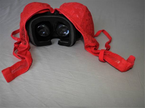 istock Virtual reality glasses for mobile devices with red underwear on top, VR technology is used for VR porn and adult entertainment. 1139243788