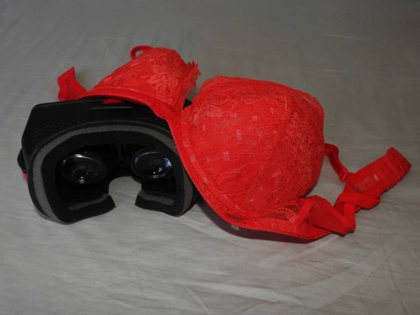 istock Virtual reality glasses for mobile devices with red underwear on top, VR technology is used for VR porn and adult entertainment. 1139243800