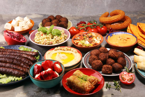 istock Middle eastern or arabic dishes and assorted meze, concrete rustic background. Falafel. Turkish Dessert Baklava with pistachio. Halal food. Lebanese cuisine 1139246280