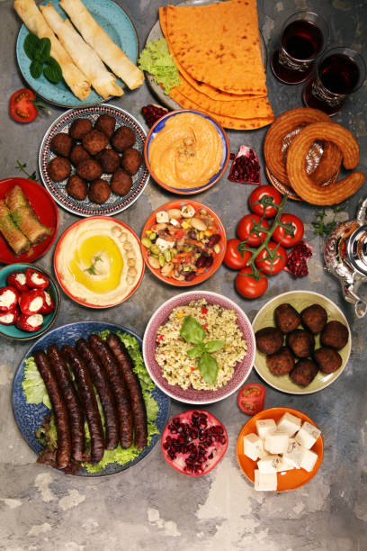 istock Middle eastern or arabic dishes and assorted meze, concrete rustic background. Falafel. Turkish Dessert Baklava with pistachio. Halal food. Lebanese cuisine 1139246394