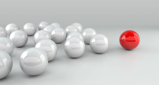 istock Leadership Concept, Red Leader Ball Leading Whites 1139246932