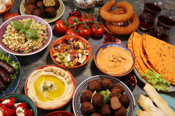 istock Middle eastern or arabic dishes and assorted meze, concrete rustic background. Falafel. Turkish Dessert Baklava with pistachio. Halal food. Lebanese cuisine 1139247036