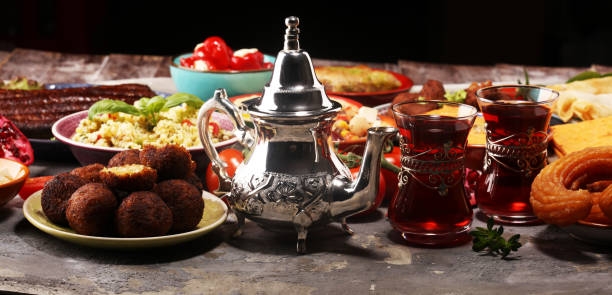 istock Middle eastern or arabic dishes and assorted meze, concrete rustic background. Falafel. Turkish Dessert Baklava with pistachio. Halal food. Lebanese cuisine 1139247073