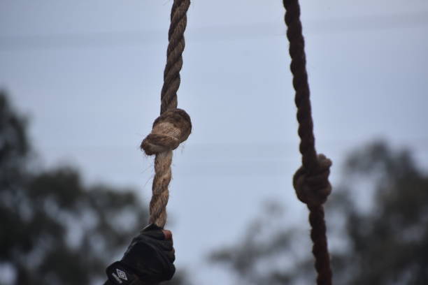 istock Challenge climbing rope and touching the bell in the mud 1139248704