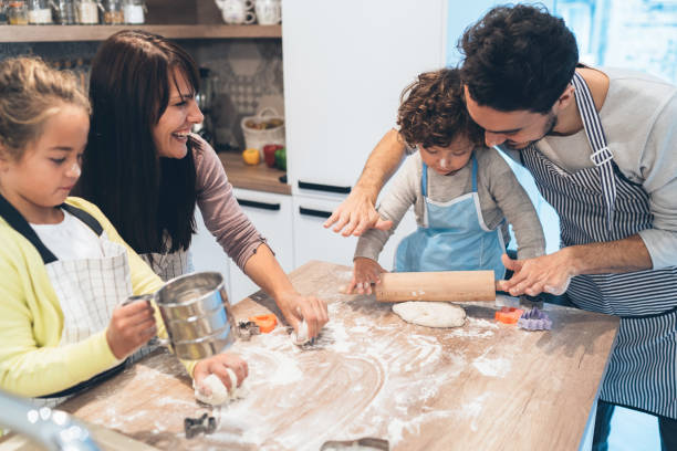 istock Family making cookies in kitchen 1139251631