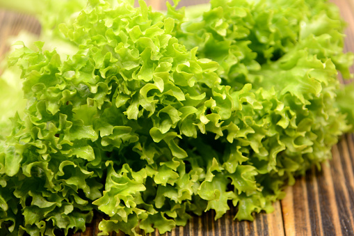 Lettuce leaves on wooden table Green salad Healthy food