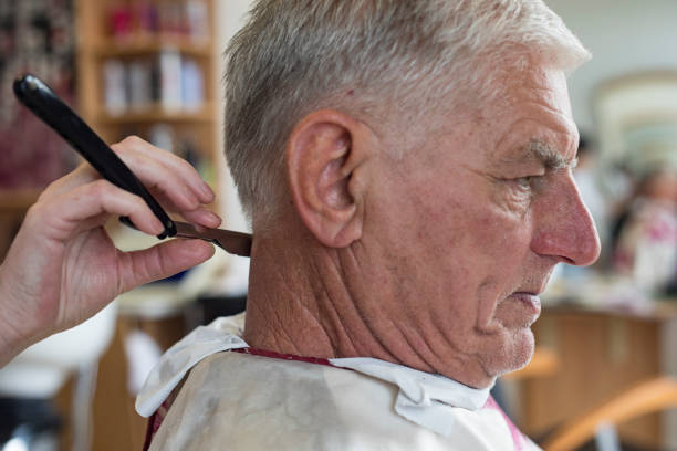 istock Senior Man Getting His Neck Shaved With a Razor 1139253781
