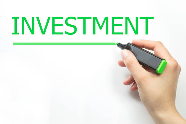 istock INVESTMENT word written 1139256609