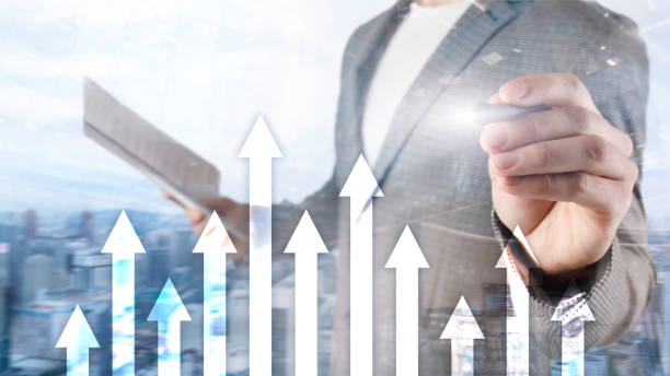 istock Up arrow graph on skyscraper background. Invesment and financial growth concept. 1139257704