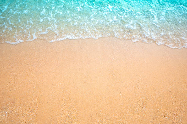 istock Sand beach and green sea wave on overview 1139258489