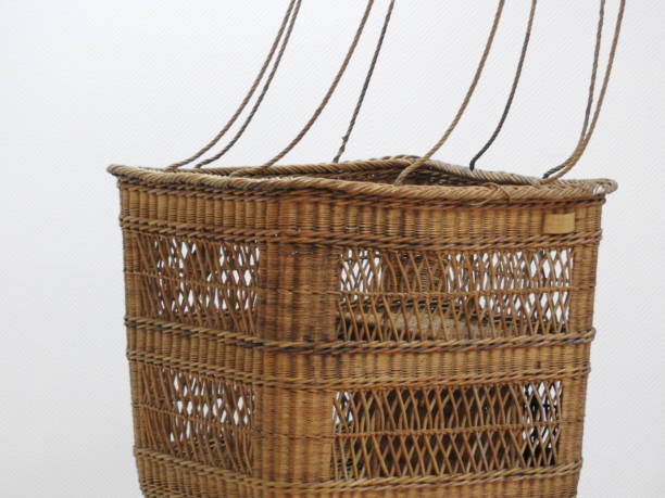 Fishing net and wicker fish creel antique outdoor sports equipment.