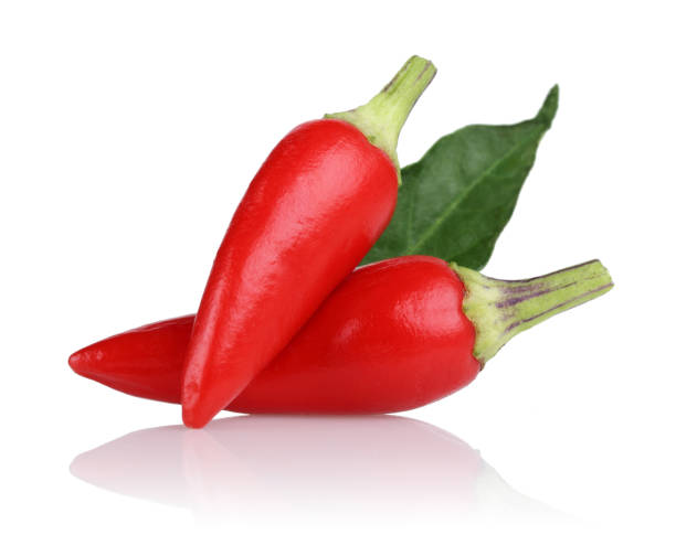 istock Red peppers and leaf isolated on white 1139260498