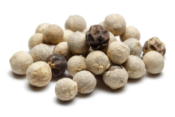 istock Heap of white peppercorn isolated on white 1139260810