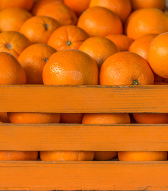 istock Oranges in the orange crate. Cage full of oranges. 1139260981