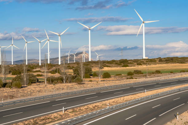 istock Highway on its way through a wind farm 1139261778