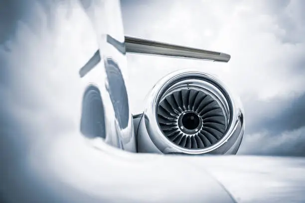 Detail of a corporate jet fuselage and engine.