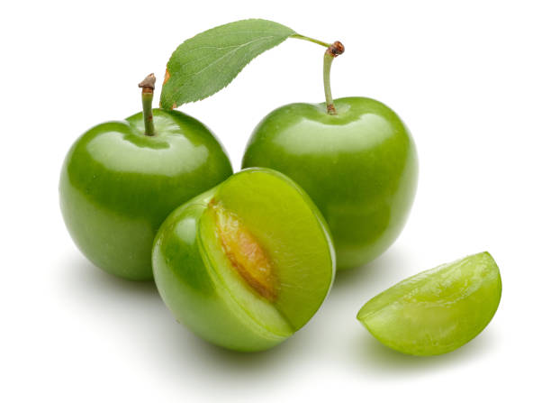istock Fresh green plums with leaf isolated on white 1139263170