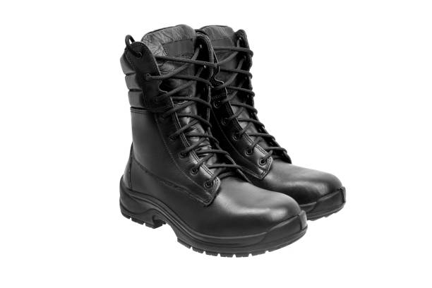 istock Black military leather boots isolated on white background 1139264482