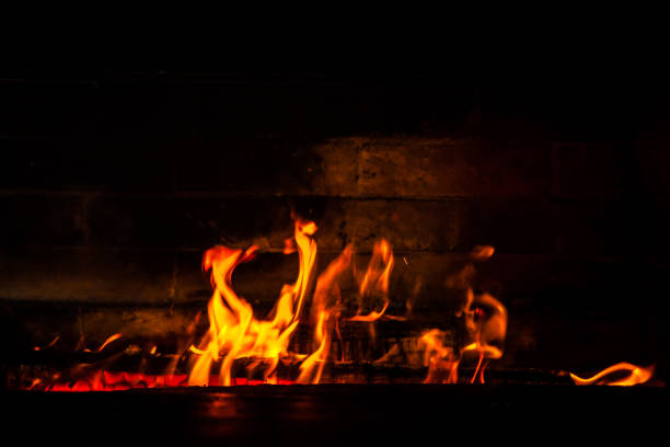 istock firewood burning red fire on a black background 1139264497