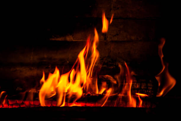 istock firewood burning red fire on a black background 1139264554