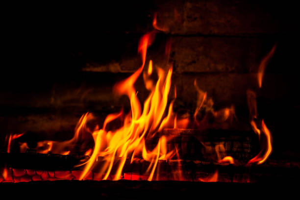istock firewood burning red fire on a black background 1139264587
