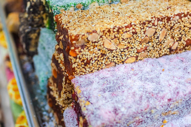 istock Multicolored bars Turkish delight rakat with nuts oriental sweets, soft selective focus. Middle Eastern sweets. View from above. 1139268739