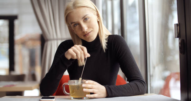 istock Young girl enjoying her tea in restaurant. 1139273046
